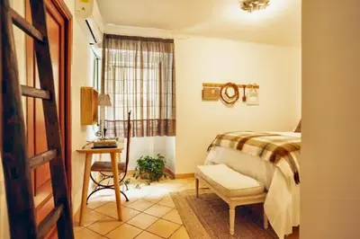 Letto o letti in una camera di The Little House in Napoli