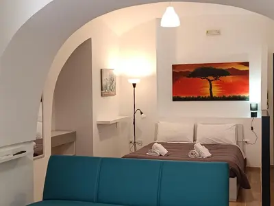 Letto o letti in una camera di Ortensia Casa Vacanze Napoli