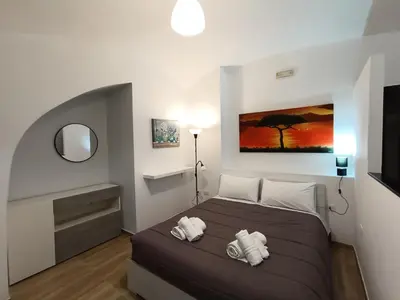 Letto o letti in una camera di Ortensia Casa Vacanze Napoli