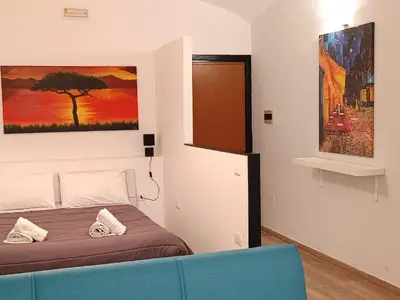 Letto o letti in una camera di Ortensia Casa Vacanze Napoli
