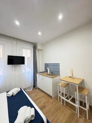 TV o dispositivi per l'intrattenimento presso Neapolitan Suites