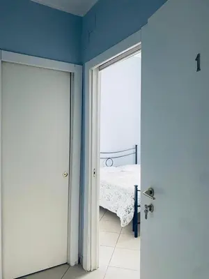 Letto o letti in una camera di Noviello Apartments VIA DEI MILLE 4 posti