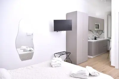 Letto o letti in una camera di Rivieras House - Central Suites Naples
