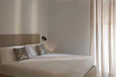 Letto o letti in una camera di Domus Milone