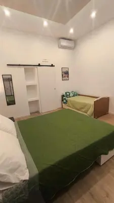 Letto o letti in una camera di Casa San Donato Centro Storico Duomo