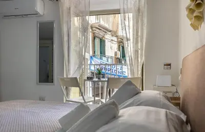 Letto o letti in una camera di Relais Borbonico Chiaia