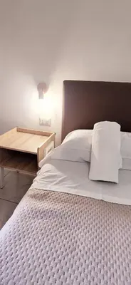 Letto o letti in una camera di Relais Borbonico Chiaia