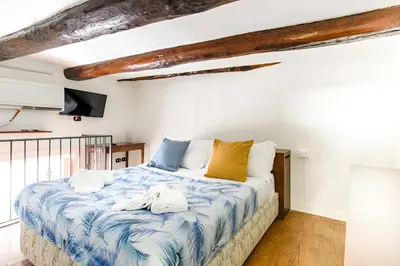 Letto o letti in una camera di Neapolis Apartment Santa Lucia