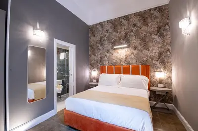 Letto o letti in una camera di Leone Camere D'autore - Rooftop Prince Centro Storico