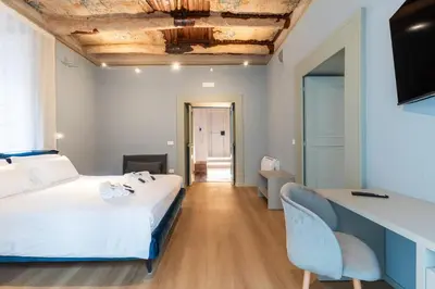 Letto o letti in una camera di Il Disinganno - Elegant Historic Residence in the center