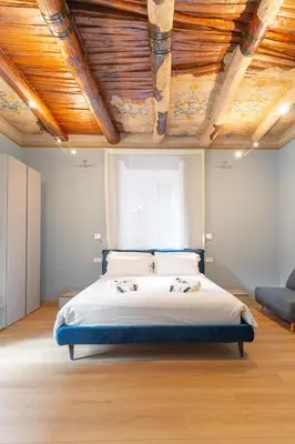 Letto o letti in una camera di Il Disinganno - Elegant Historic Residence in the center