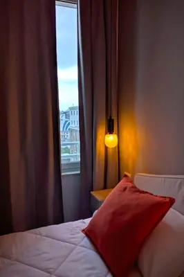 Letto o letti in una camera di Incoming Roof Bovio