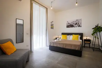 Letto o letti in una camera di Napoli Movie Apartments