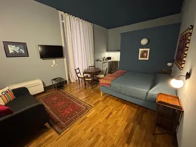 Area soggiorno di Rosso Napoli Suites