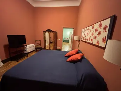 Letto o letti in una camera di Rosso Napoli Suites