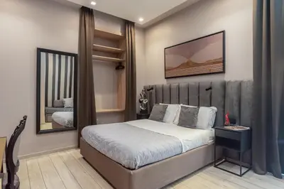 Letto o letti in una camera di Neapolis Lifestyle