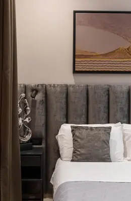 Letto o letti in una camera di Neapolis Lifestyle