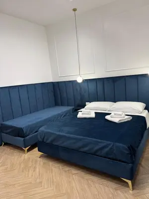 Letto o letti in una camera di Sanitá sub 32