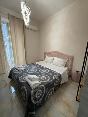 Letto o letti in una camera di VALENTINO 48 napoli centro
