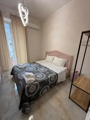 Letto o letti in una camera di VALENTINO 48 napoli centro