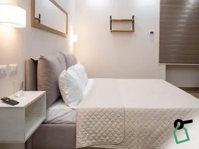 Letto o letti in una camera di Hotiday Napoli Stella