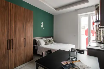 Letto o letti in una camera di Materdei Rooms - Napoli Centro, Camere con cucina vicino Metro e colazione inclusa