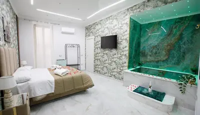 Letto o letti in una camera di B&B luxury house green
