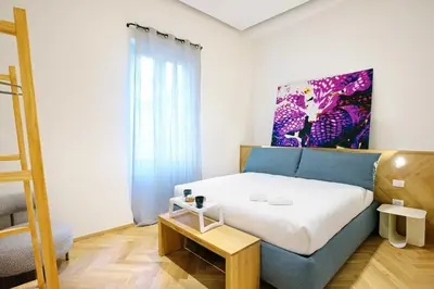 Letto o letti in una camera di Real Passeggio Guest House - Dimore Partenopee