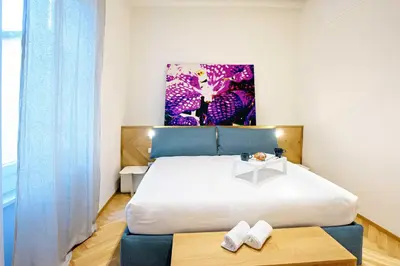 Letto o letti in una camera di Real Passeggio Guest House - Dimore Partenopee