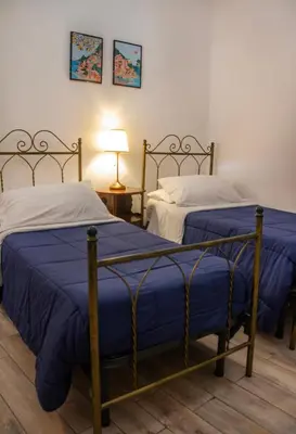 Letto o letti in una camera di B&B Epoche'