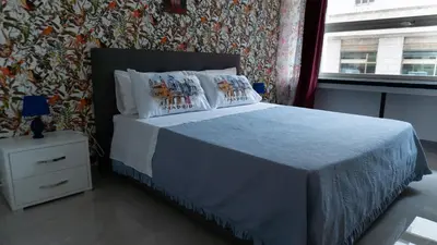 Letto o letti in una camera di La bella napoli house casa vacanze con 3 camere da letto
