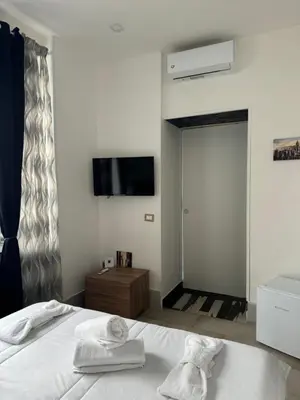 Letto o letti in una camera di Vista Vesuvio