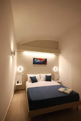 Letto o letti in una camera di Le chiavi di Parthenope