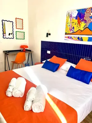 Letto o letti in una camera di Alleria suites napoli