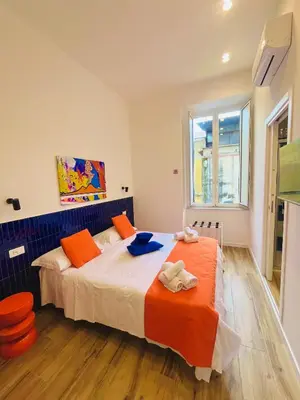Letto o letti in una camera di Alleria suites napoli