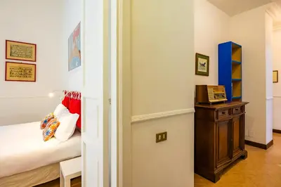 Letto o letti in una camera di La Casa di Famiglia by NapoliApartments