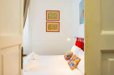 Letto o letti in una camera di La Casa di Famiglia by NapoliApartments