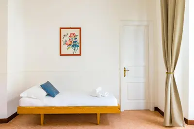 Letto o letti in una camera di La Casa di Famiglia by NapoliApartments