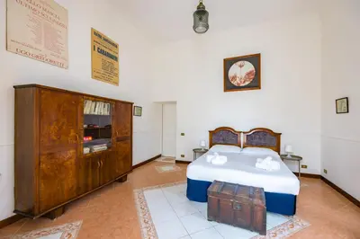 Letto o letti in una camera di La Casa di Famiglia by NapoliApartments
