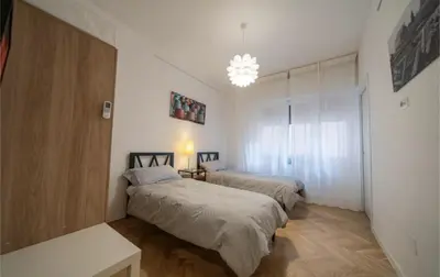 Letto o letti in una camera di New Domus San Martino