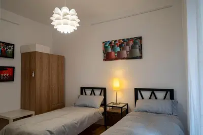 Letto o letti in una camera di New Domus San Martino