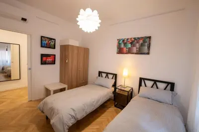 Letto o letti in una camera di New Domus San Martino