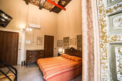 Letto o letti in una camera di Palazzo Argentino
