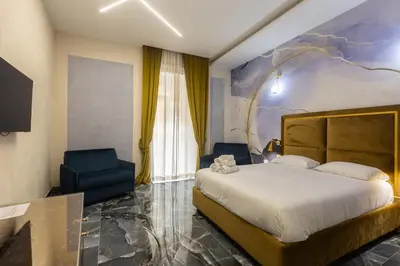 Letto o letti in una camera di Relais Chiaia