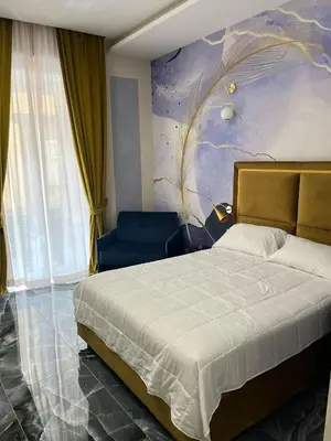Letto o letti in una camera di Relais Chiaia