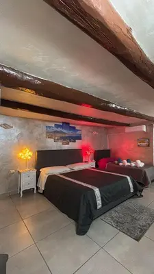 Letto o letti in una camera di Il Rifugio di Kekka piazza del Plebiscito Napoli