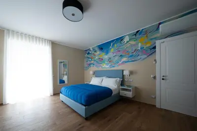 Letto o letti in una camera di Via Toledo 156 Napoli Cozy Rooms