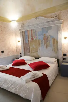 Letto o letti in una camera di Odeon Neapolis - Historic Suites in Roman Theater