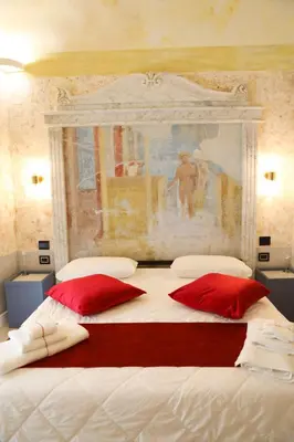 Letto o letti in una camera di Odeon Neapolis - Historic Suites in Roman Theater