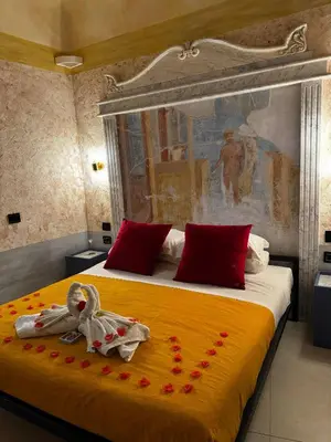 Letto o letti in una camera di Odeon Neapolis - Historic Suites in Roman Theater